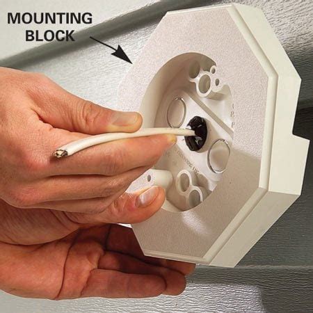 junction box that fits inside vinyl mounting block|flood light junction box installation.